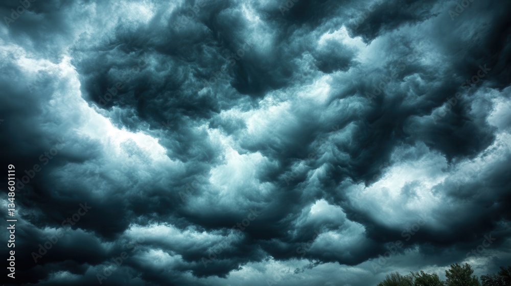 Obraz premium Dramatic Dark Clouds Over a Landscape Before a Storm