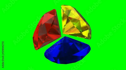 Three colorful diamonds rotating on a green screen background.