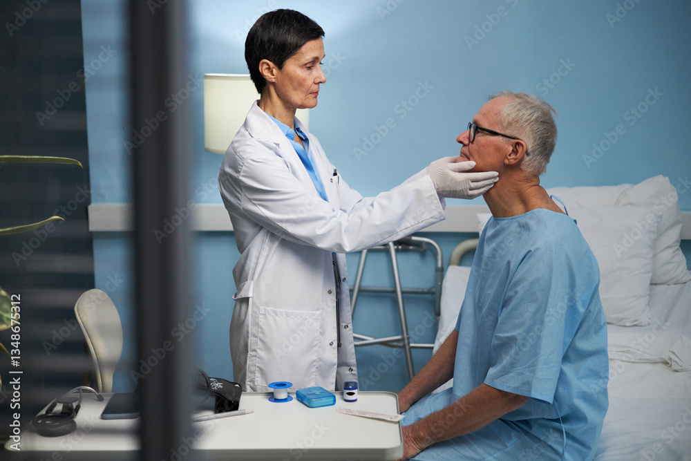 Fototapeta premium Doctor wearing white coat examining senior man in hospital room filled with medical equipment, ensuring proper diagnosis and patient care