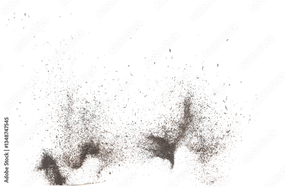 Fototapeta premium Black dried leave Tea explode. Small Fine size tea leaf flying explosion, Abstract cloud fly. Brown colored Teas splash throwing in Air. White background Isolated high speed shutter, throwing freeze