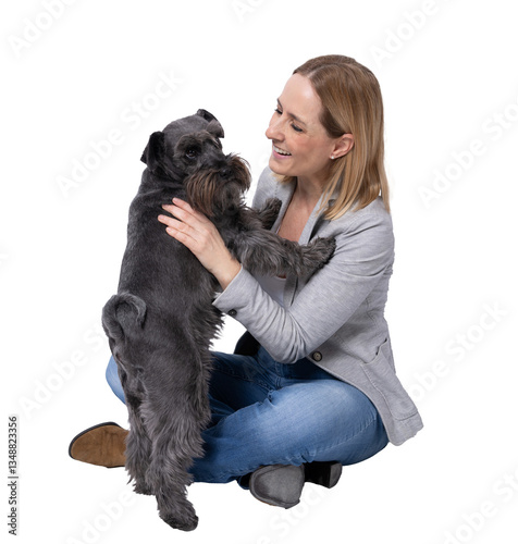 Young woman sitting on floor hugging little schnauzer dog isolated over transparent background. PNG transparent.
