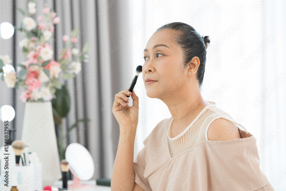 Asian woman, fashion and apply beauty. Asian adult woman applying makeup with brush at dressing table. Woman applying cosmetic mascara on cheek or cheekbones Asian woman, fashion and apply beauty. Asian adult woman applying makeup with brush at dressing table. Woman applying cosmetic mascara on cheek or cheekbones