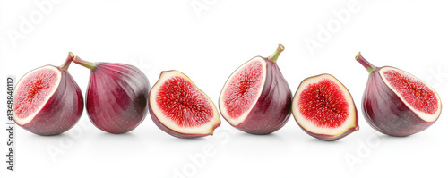 Fresh figs sliced in half showing red interior seeds arranged in a row on a white isolated background healthy exotic fruit concept

