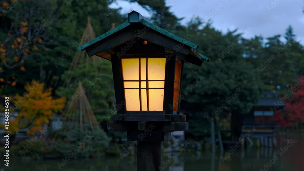 A traditional Japanese lantern glows softly in the night, illuminating the peaceful paths of Kanazawa’s Kenroku-en Gardens. A traditional Japanese lantern glows softly in the night, illuminating the peaceful paths of Kanazawa’s Kenroku-en Gardens.