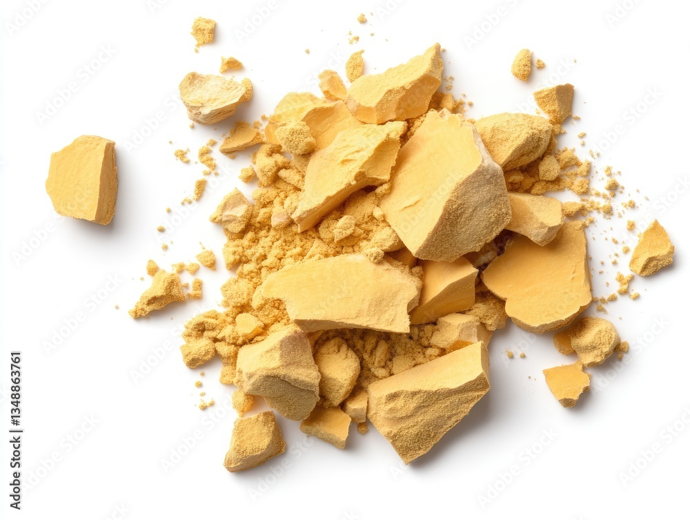 Crushed yellow substance on white background Crushed yellow substance on white background