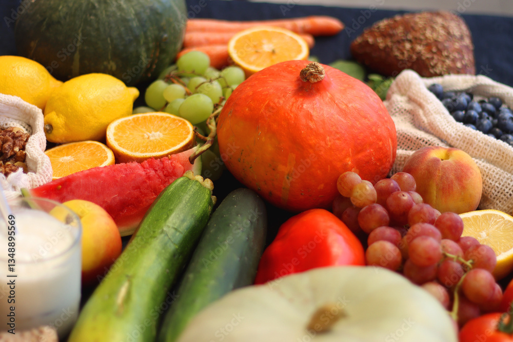 Various healthy fruits, vegetables and cereals on dark background. Selective focus.