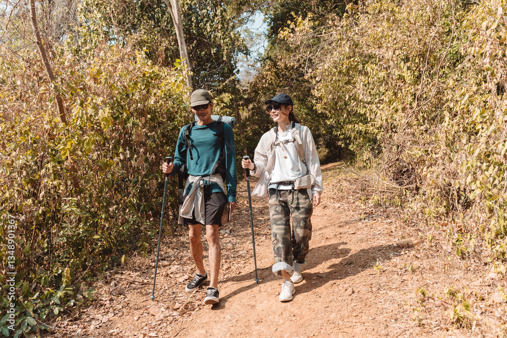Obraz premium Hiking Couple Activity climbing on mountain backpack travel and adventure, Travel lifestyle in nature.