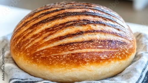 Wallpaper Mural A freshly baked artisan loaf of bread sits on cloth Torontodigital.ca