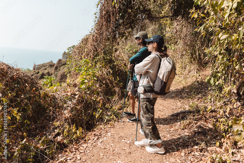 Naklejka premium Hiking Couple Activity climbing on mountain backpack travel and adventure, Travel lifestyle in nature.