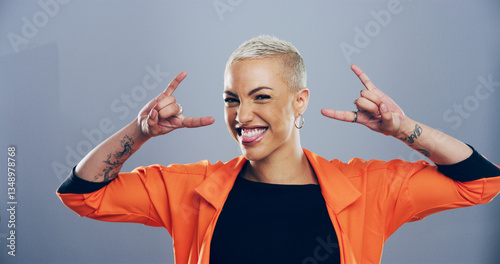Εκτύπωση καμβά Portrait, edgy or happy woman with rock hand gesture in studio for expression or space on gray background