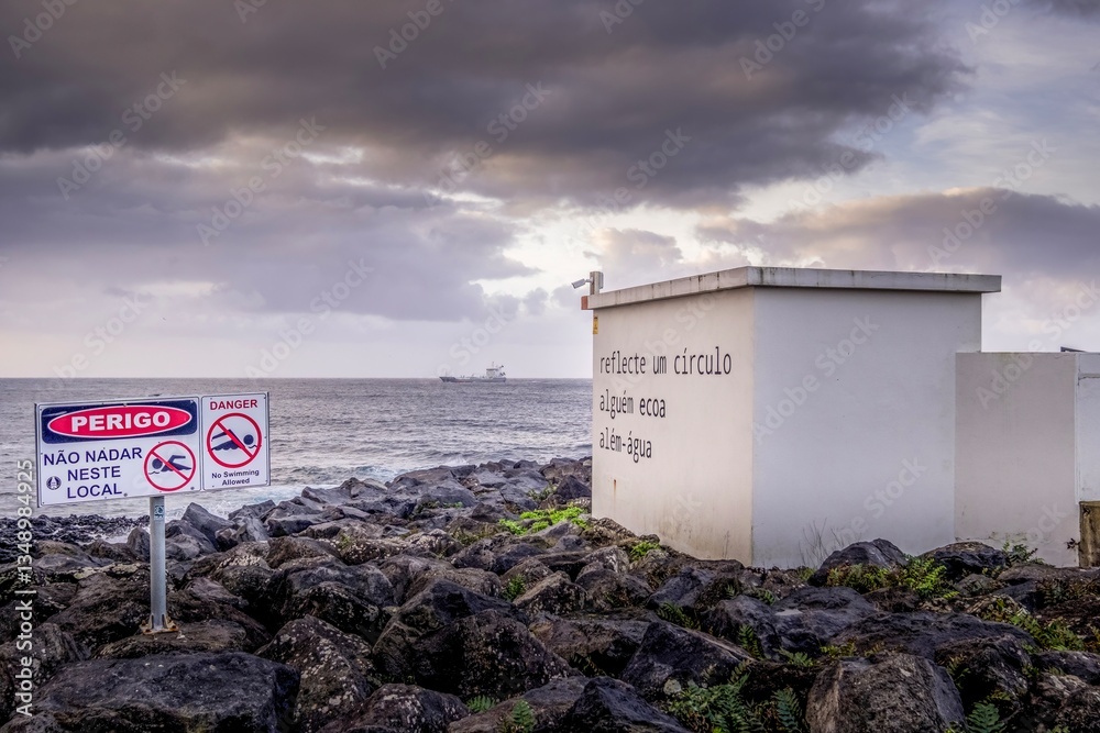 Coastal Mystery: Sao Miguel Wall Inscription. Intriguing wall with poetic inscription and a