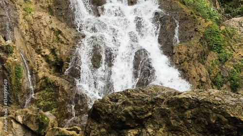 Medium shot of Go Lao Waterfall during the day with water splashing in Mai Chau, Hoa Binh Province, Vietnam, static photo