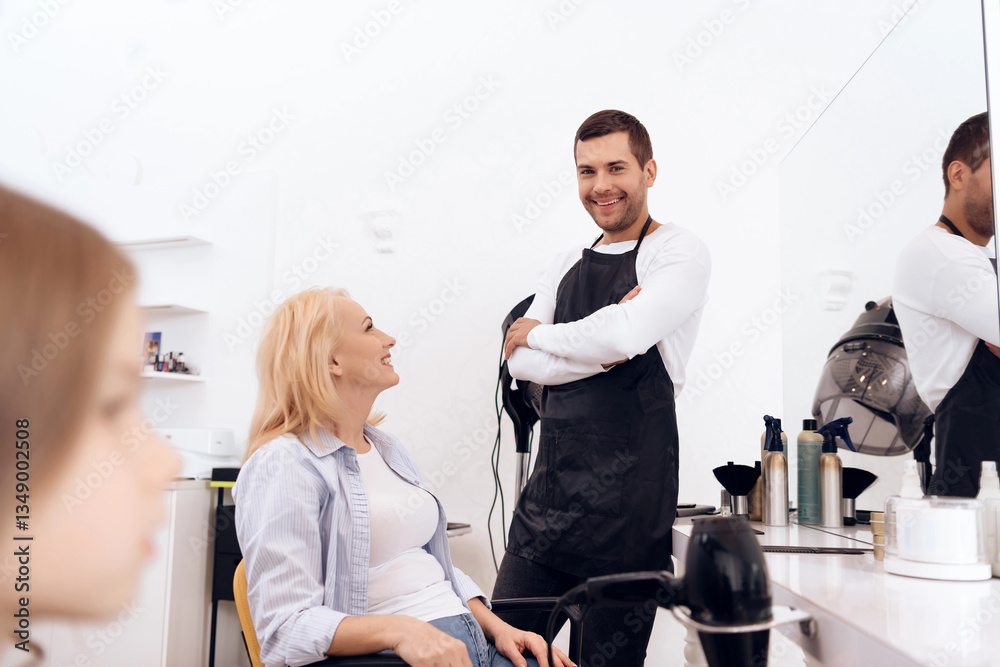 Obraz premium Mature pretty woman is doing hairdo in beauty salon. Female stylish haircut.