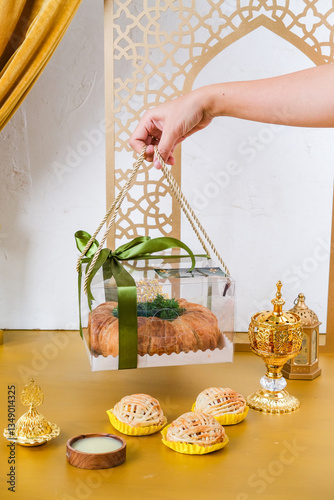 Ladies Hand Holding Ramadan and EID Mubarak Food Hampers With Box