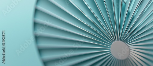 Close-up of a circular object with a light blue background. the object appears to be made up of thin, white lines that are arranged in a radial pattern, creating a sense of depth and dimension.