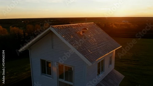 Aerial view of home construction site with exposed wooden framework and open layout
