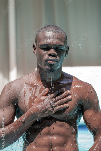 Black Man Relaxing in Pool with Eyes Closed