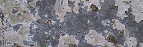 Peeling paint on the wall. Panorama of a concrete wall with old cracked flaking paint. Weathered rough painted surface with patterns of cracks and peeling. Wide panoramic grungy texture for background