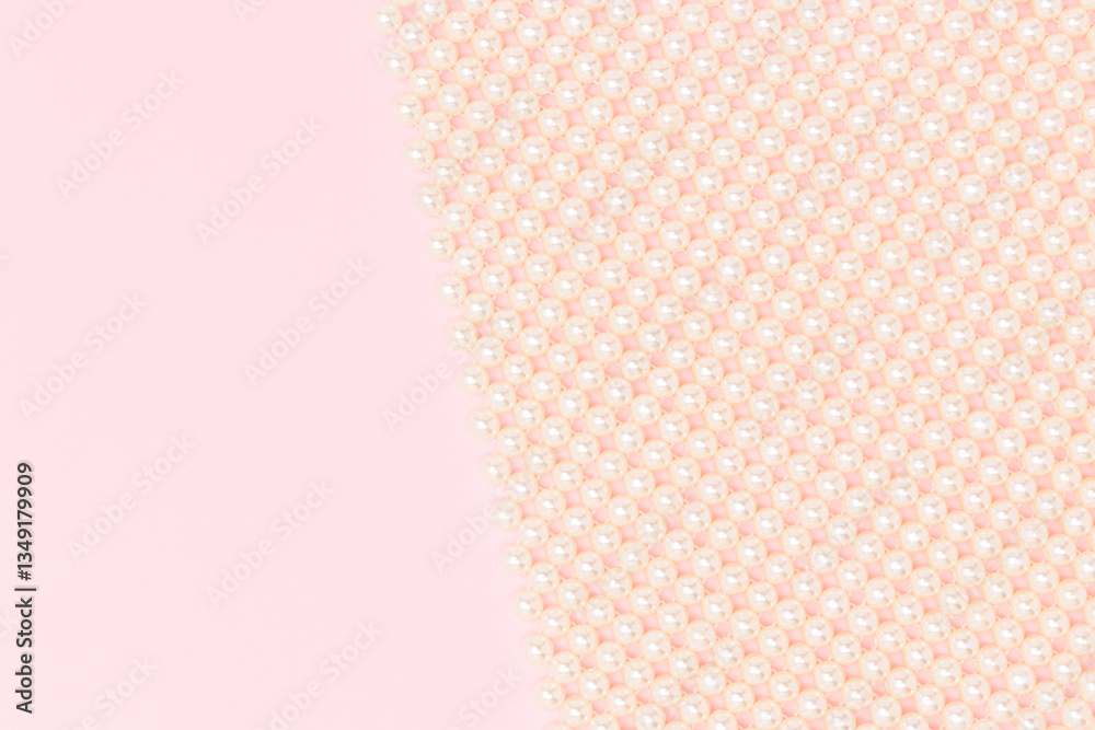 Detail for handmade bag made from pearl imitation beads on a pink background with copy space. Detail for handmade bag made from pearl imitation beads on a pink background with copy space.