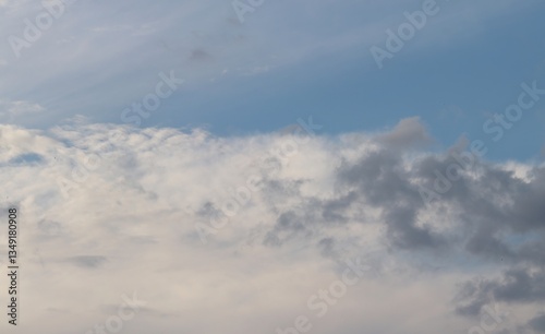 A close-up of the cloudy sky. Color background. Soft shapes. Simple composition. Abstract environment. Atmosphere of presence. Picture. Wallpaper. Poster. Postcard. Place to insert