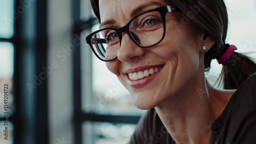 The Smiling Woman in Glasses