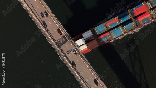 Wallpaper Mural Aerial View Of A Loaded Cargo Ship Passing Under A Suspension Bridge Into The Port Of Halifax, Canada. The Scene Illustrates The Vital Role Of Maritime Trade And International Shipping Logistics. Torontodigital.ca