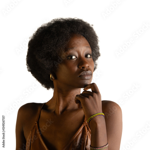 A poised young woman with curly hair gazes confidently into the camera against a clean white background.