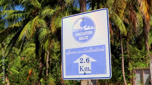 Tsunami evacuation route and hazard zone sign Khao Lak Thailand.