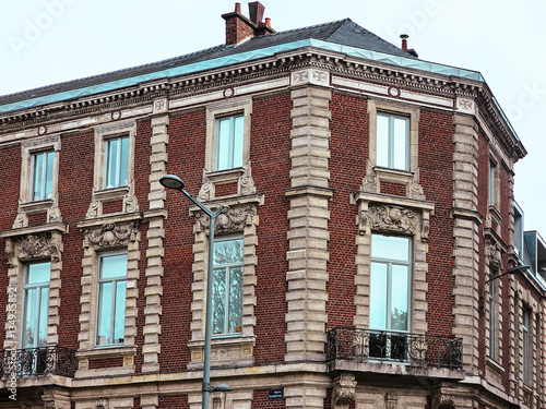 Low-Angle View of Red Brick French Architecture building Facade in Lille, France