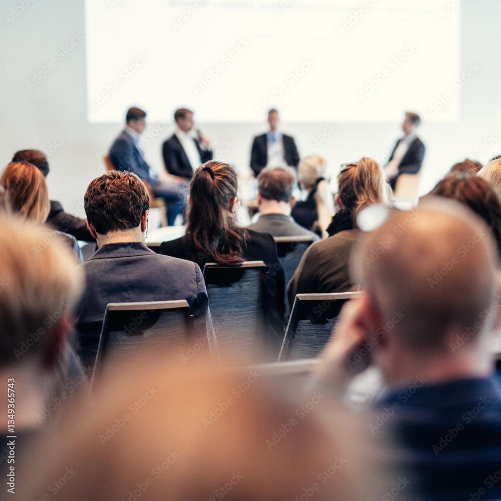 Obraz premium Interview and round table discussion at business convention and presentation. Audience at the conference hall. Business and entrepreneurship symposium.