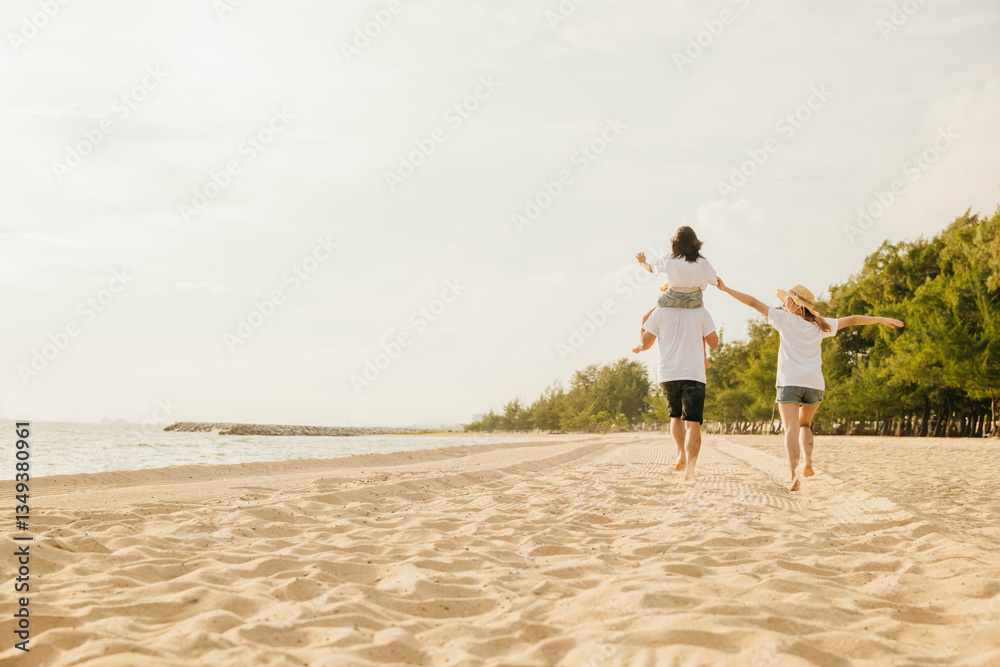 Happy family in holiday. Father, Mother and kids having fun together shoulder ride and running on summer beach, Parents carrying children on neck, family is enjoying their summer in sunset time Happy family in holiday. Father, Mother and kids having fun together shoulder ride and running on summer beach, Parents carrying children on neck, family is enjoying their summer in sunset time