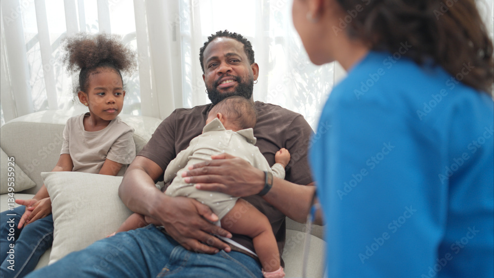 Obraz premium A doctor uses a stethoscope to check on the health of a little boy as he sleeps in his father's arms
