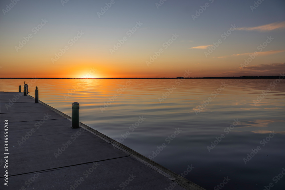 Fototapeta premium Different views of the sunset over Lake Eustis in Eustis, Florida