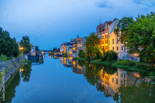 Obraz na płótnie Townhouses during Blue Hour by Odra River in Opole Venice, Opole, Poland w salonie