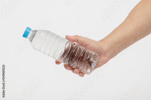 Hand holding water bottle isolated on white background with clipping path