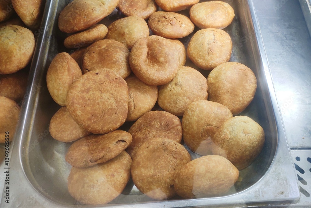 Kachori is a deep-fried, spicy, stuffed pastry originating from the Marwar region of Rajasthan, India. It is made of maida filled with a stuffing of baked mixture of moong dal or onions. Kachori is a deep-fried, spicy, stuffed pastry originating from the Marwar region of Rajasthan, India. It is made of maida filled with a stuffing of baked mixture of moong dal or onions.