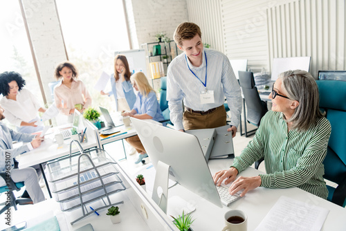 Professional team working together in a modern office environment emphasizing cooperation and dynamism