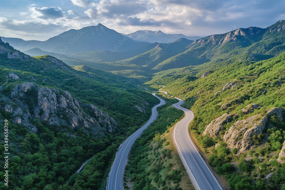 Fototapeta premium Landscape view of uphill road among forest with peaceful and relax vibe in the morning, Aerial view natural trail on the hill among the valley.