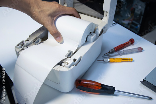 Wallpaper Mural Top view. Technician repairing printer, label printer.. Torontodigital.ca