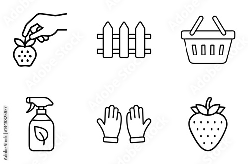 Hand picking strawberries with gardening tools and basket in garden  