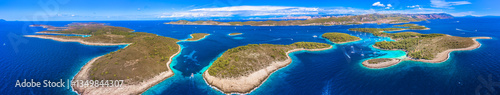 A breathtaking panoramic view of the Pakleni Islands with Hvar in the background, showcasing the stunning Adriatic seascape, and crystal-clear waters of this famous sailing and yachting destination