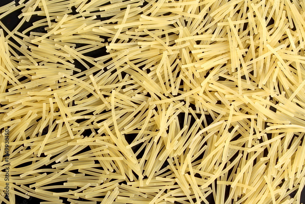 Pasta background in the form of spider web vermicelli. Pasta background in the form of spider web vermicelli.