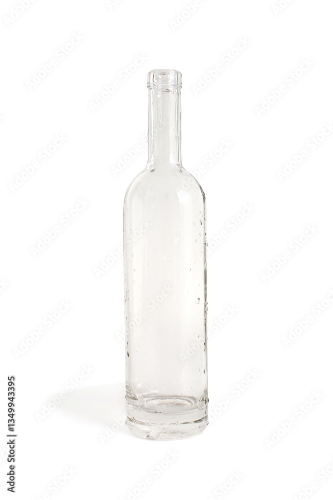 There is a transparent glass bottle empty with drops of water. There is a transparent glass bottle empty with drops of water.