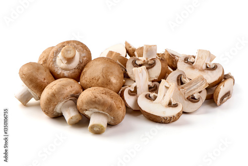 Fresh cremini mushrooms, whole and sliced, isolated on white background.