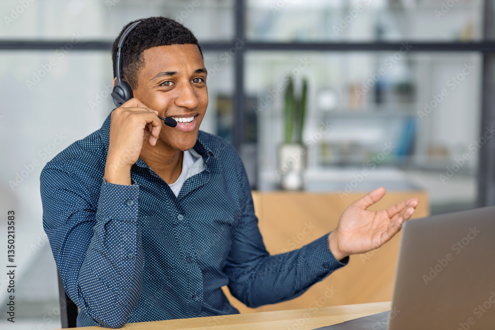 Smiling businessman in headset having online conversation