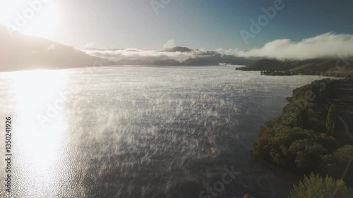 Wallpaper Mural Wide shot of mist covering a lake which is evaporating in the heat of the morning sun. Torontodigital.ca