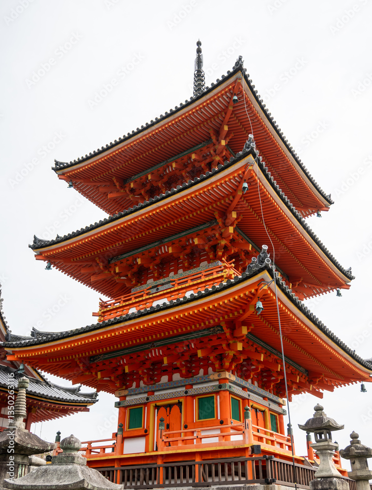 Elegant structure of Kiyomizudera's three-tiered vermilion pagoda. Its vermilion color symbolizes protection while green panels ward off evil. Elegant structure of Kiyomizudera's three-tiered vermilion pagoda. Its vermilion color symbolizes protection while green panels ward off evil.