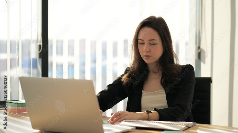 Good-looking young smiling successful woman stylish dressed working on freelance platform. Portrait of beautiful girl enjoying online office work in big company. Success in professional business job Good-looking young smiling successful woman stylish dressed working on freelance platform. Portrait of beautiful girl enjoying online office work in big company. Success in professional business job