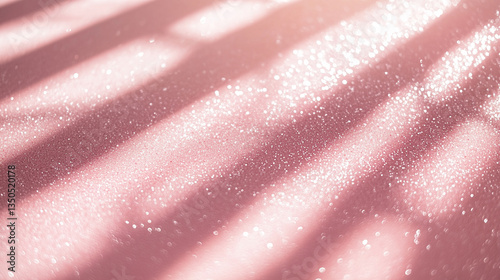 Soft pink surface illuminated by sunlight, creating sparkles and shadows for a dreamy atmosphere