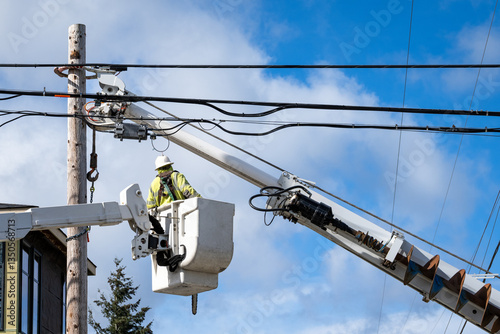Konstfotografi Utility digger derrick truck with pole setting equipment, lineman in lift bucket